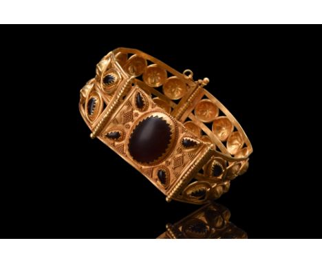 Ca. 4th century BC.A gold bracelet of a D-shaped form. Its meticulously designed openwork body unveils a visual symphony of i