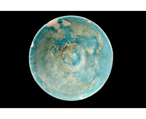Ca. 1100-1200 AD.A pottery bowl with a truncated conical form, elevated foot, and flaring sides combine to create an aestheti