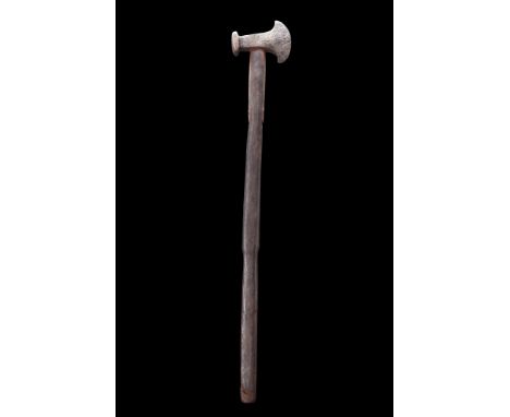 Ca. 1100-1200 AD.An iron forged battle axe with head widening towards the concave cutting-edge, the neck with central socket 
