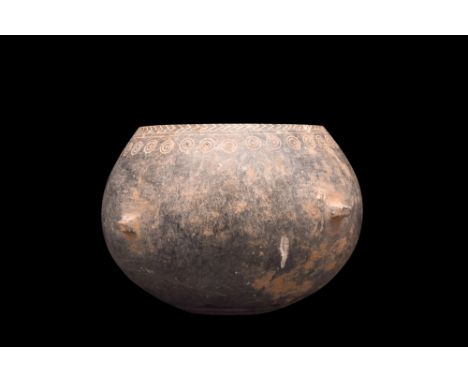 Ca. 1st millennium BC.A vessel hewn from schist, a metamorphic rock, and characterized by its elegantly rounded body, which e