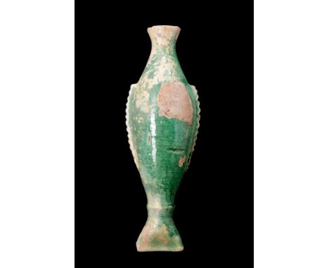 Ca. 1100-1200 AD.A pottery fish-shaped vessel, with its distinct tail-like base and a spout resembling the mouth of a fish, p