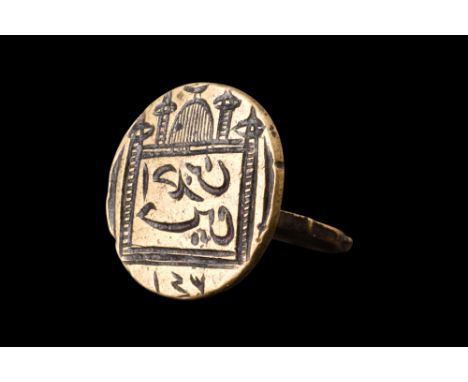 Ca. 19th century AD.A brass circular seal stamp. Crafted with meticulous attention to detail, this seal stamp showcases a fla