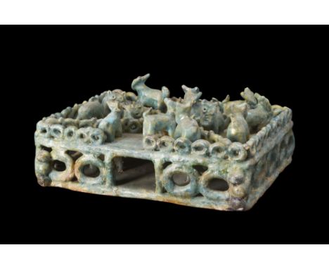 Ca. 1100-1200 AD (or later).A glazed ceramic two-floored model, adorned with a stunning turquoise glaze. The model is compose