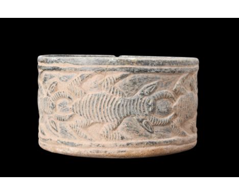 Ca. 3rd-2nd millennium BC.Crafted from schist, this bowl showcases a distinct combination of form and ornamentation. The bowl