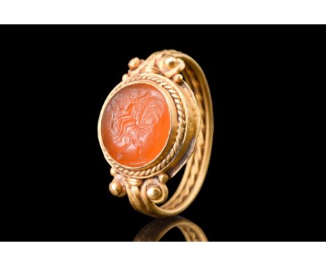 Ca. 3rd - 4th century AD.&nbsp;A remarkable intaglio featuring the captivating imagery of Mercury riding a rooster, nestled w