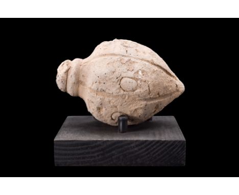 Ca. 800-1000 AD.An acorn-shaped ceramic vessel with a tapered base and broad top with a small spout that probably would have 