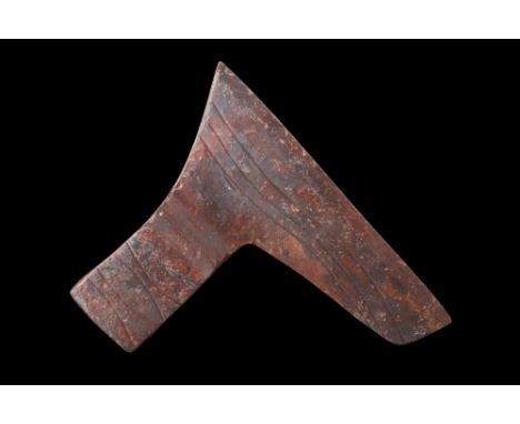 Ca. 900-1100 AD.An iron axe head, characterized by its bearded design, offers a distinctive cutting edge that extends below t