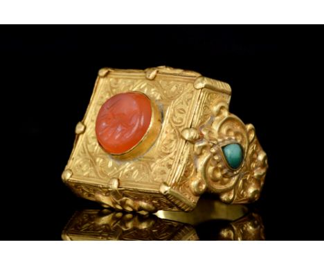 Middle East, Ca. 13th - 14th century AD. A fine gold finger ring having a box form upper portion, finely engraved with an ove