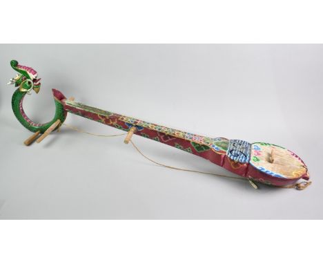 A Traditional Tibetan Eight String Lute Type Instrument with Polychrome Decoration and Dragon Headstock, 107cms Long