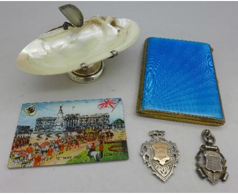 A silver mounted shell ashtray and two silver fobs, etc.