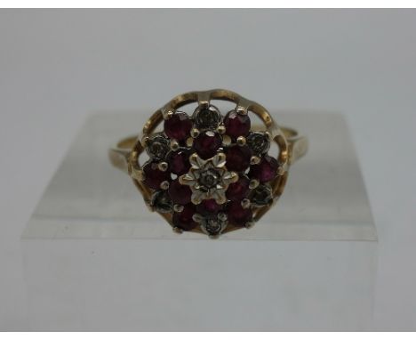 A 9ct gold, ruby and white stone ring, weight 2.6g, size N