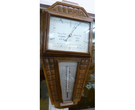 An aneroid barometer, W.T. Story Ltd., Barrow, with silver presentation plaque dated 1936, height 57cm