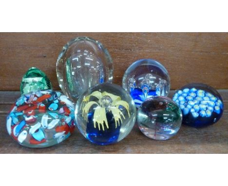 Seven paperweights including one Caithness