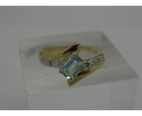 A 9ct gold, blue stone and diamond ring, weight 1.3g, size O