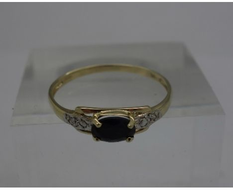 A 9ct gold, sapphire and diamond ring, weight 0.9g, size O