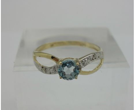 A 9ct gold, blue topaz and diamond ring, weight 0.8g, size P