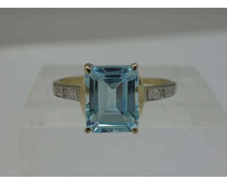 A 9ct gold, blue topaz and diamond ring, weight 1.7g, size O