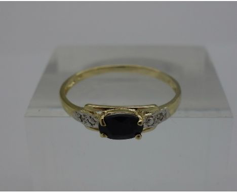 A 9ct gold, sapphire and diamond ring, weight 0.9g, size O