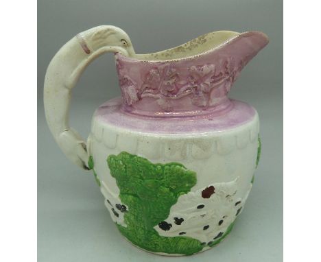 A lustre ware jug with hunting scene and a hound handle, height 16cm