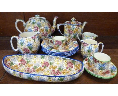 Grimwades Marguerite pottery comprising four dessert bowls, two cups and saucers, two jugs, a dish and two teapots, tea pots 