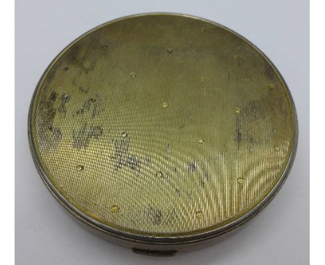 A sterling silver compact