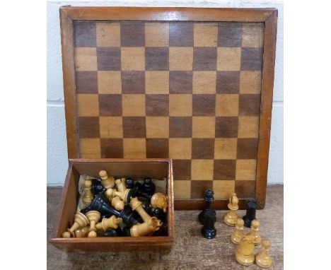 A chess set and chess board, with weighted pieces