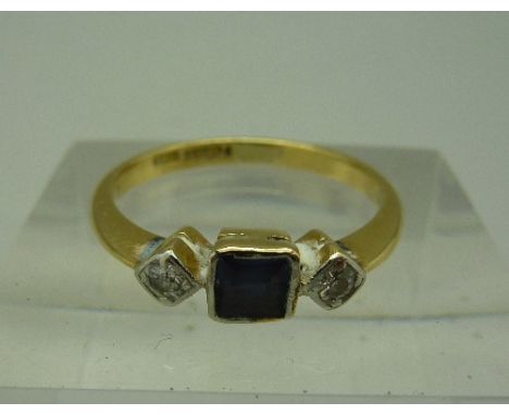 An 18ct gold, diamond and blue stone ring, weight 2.8g, size N