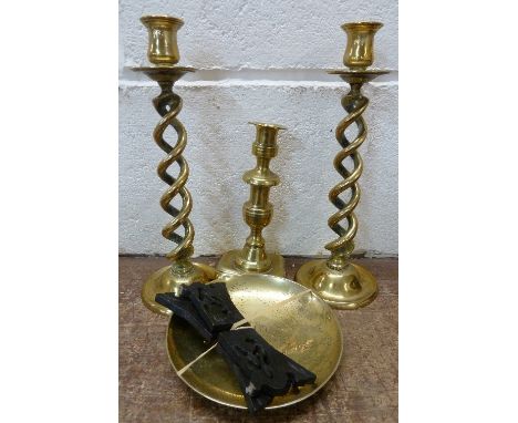 A pair of brass open twist candlesticks, a 19th Century candlestick and a brass dish
