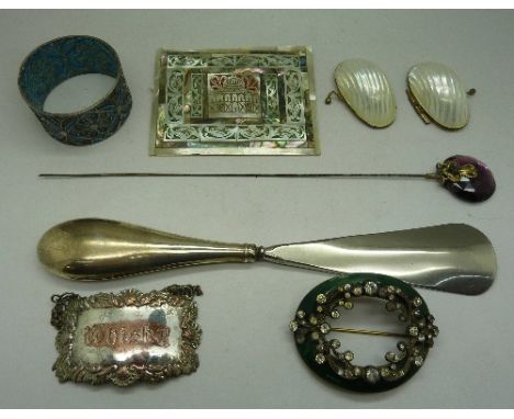 A green enamel and paste brooch, a hat pin, etc.