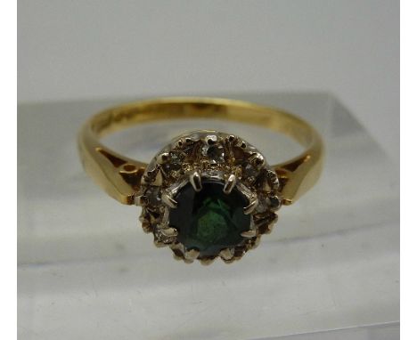 An 18ct gold, diamond and tourmaline ring, weight 2.7g, size K