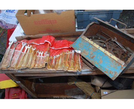 A metal box with part imperial/metric spanner set etc.