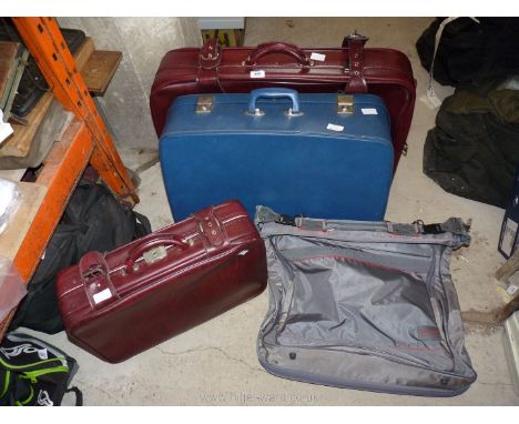 Three suitcases and a Carlton travel suit bag.