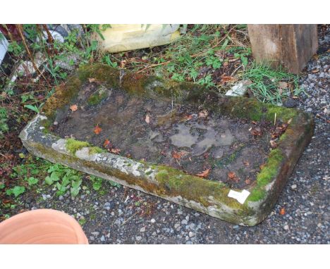 A shallow Stone trough, 37'' x 16 1/2''.