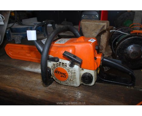 A Stihl 017 Chainsaw with 10'' cutter bar, brake working, good compression.
