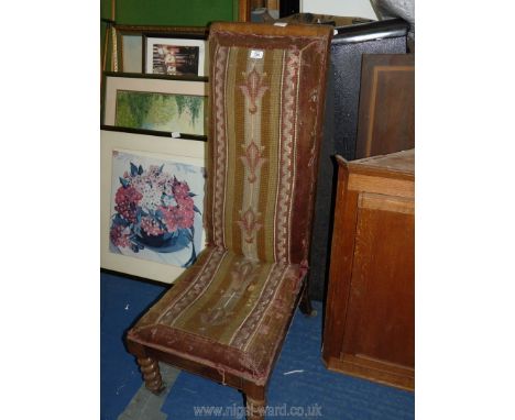 A tall backed nursing chair with tapestry seat.