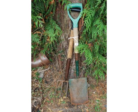 A garden fork and spade.