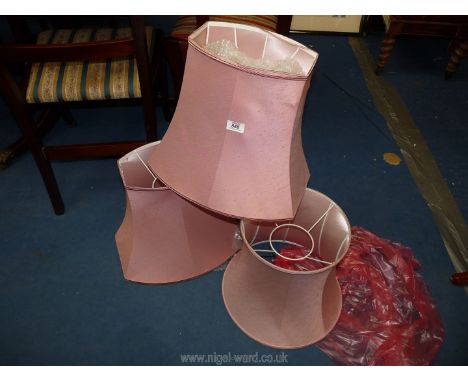 Three pink lamp shades.