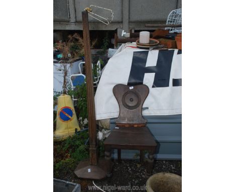 A wooden standard lamp and a hall chair in need of restoration.