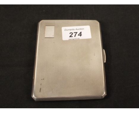A silver cigarette case with engine turned decoration