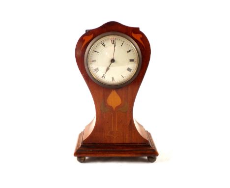 An Edwardian inlaid mahogany Art Nouveau mantel clock in waisted case
