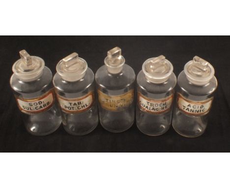 Five medicine bottles with enamel plaques