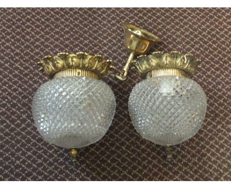A pair of gilt metal and glass light fittings