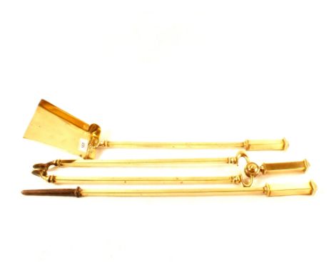 A heavy set of three Art Nouveau period brass fire irons, 25 1/2" long