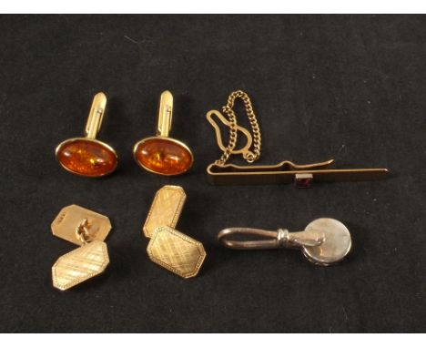 A pair of 9ct gold engine turned cufflinks, 9ct gold red stone set tie clip plus other items