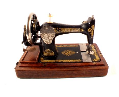A Singer sewing machine, stylophone, tripod and sundries including miniature copper pans