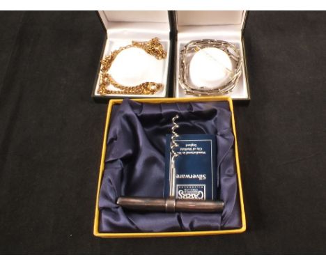 A silver handled Carrs corkscrew in presentation case, Sheffield 2000, a yellow metal necklace and bracelet, flat link form, 