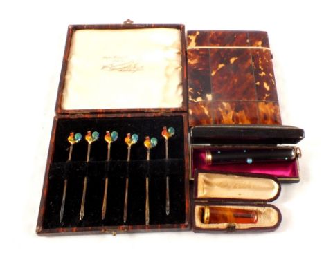 Cased silver enamel cocktail sticks, tortoiseshell card case (as found) plus two cheroot holders with yellow metal mounts
