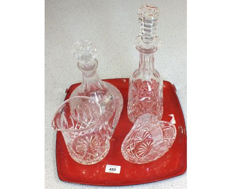 Two pieces of Waterford crystal cut glass to include a decanter and a pitcher plus two other cut glass items 