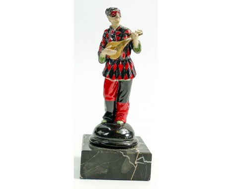 Good porcelain figure of a masked harlequin: Playing a banjo, mounted on marble plinth, height 19cm. 