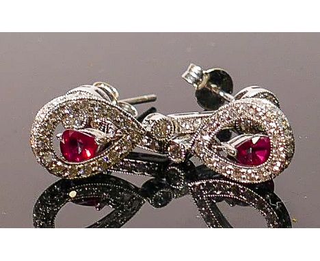 18ct white gold earrings set with diamond &amp; rubies: Each earing set with a good colour ruby and 29 small bright diamonds.